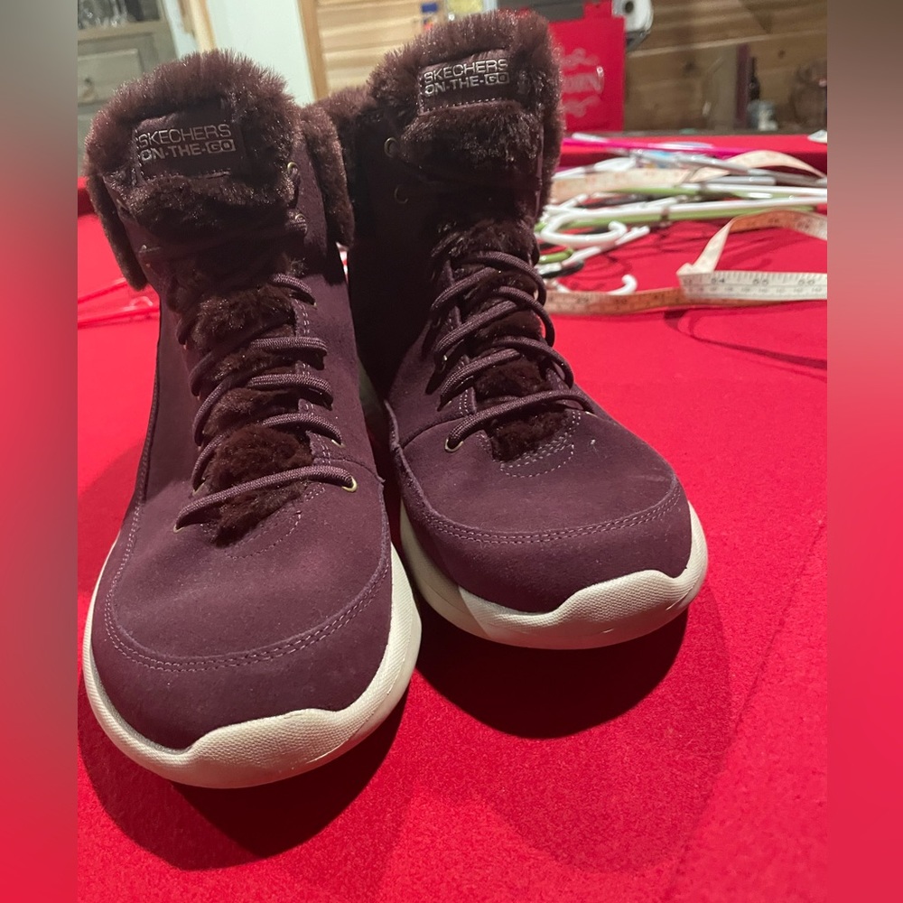 1007 Skechers slip on boots. EUC. worn one time. Furry lining. Size 9.5